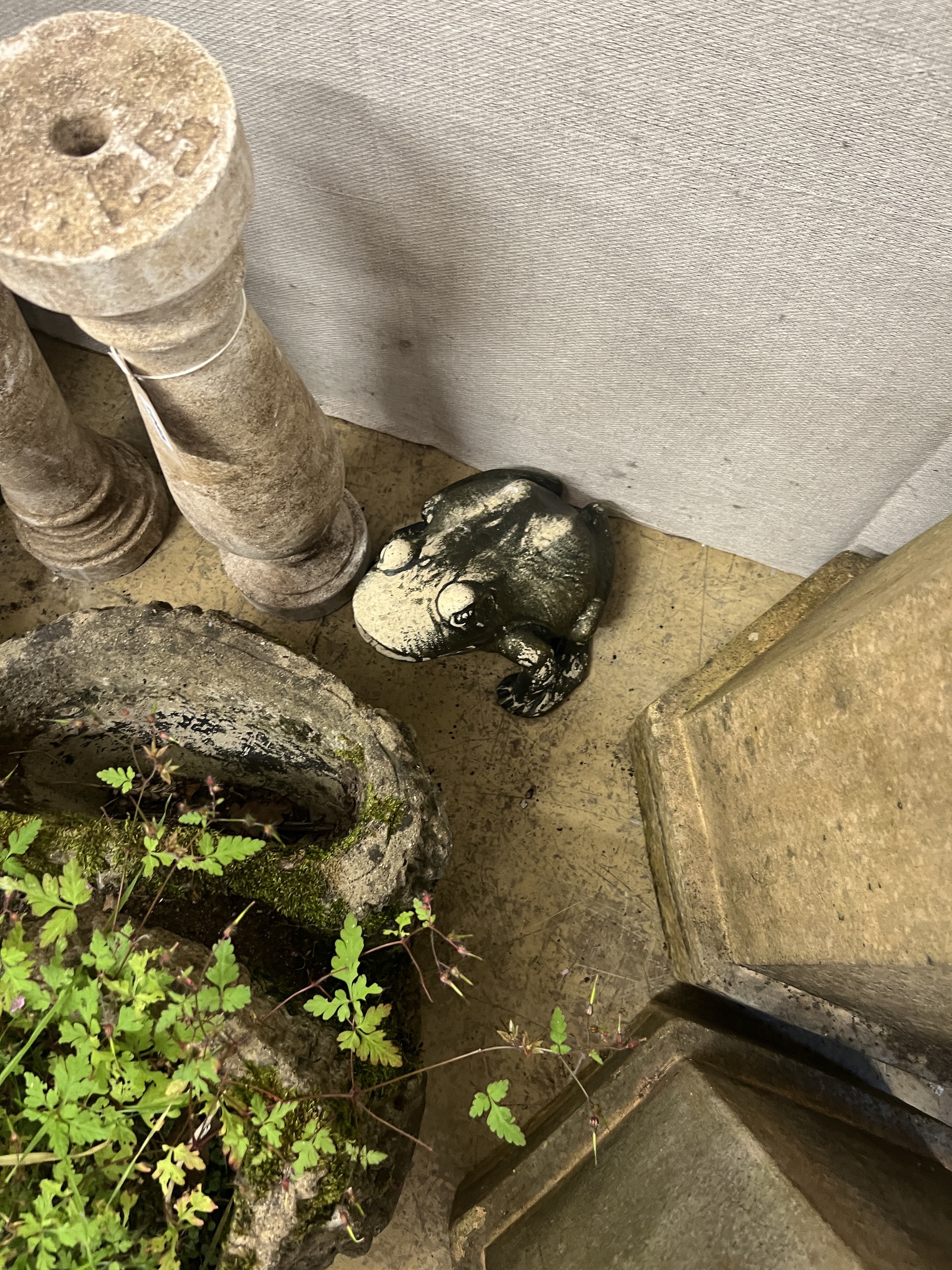 A reconstituted stone rustic branch garden planter, a pair of baluster columns, mortar and a toad